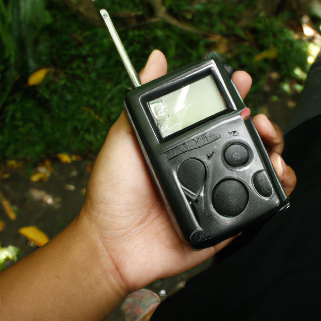 Person holding digital radio device