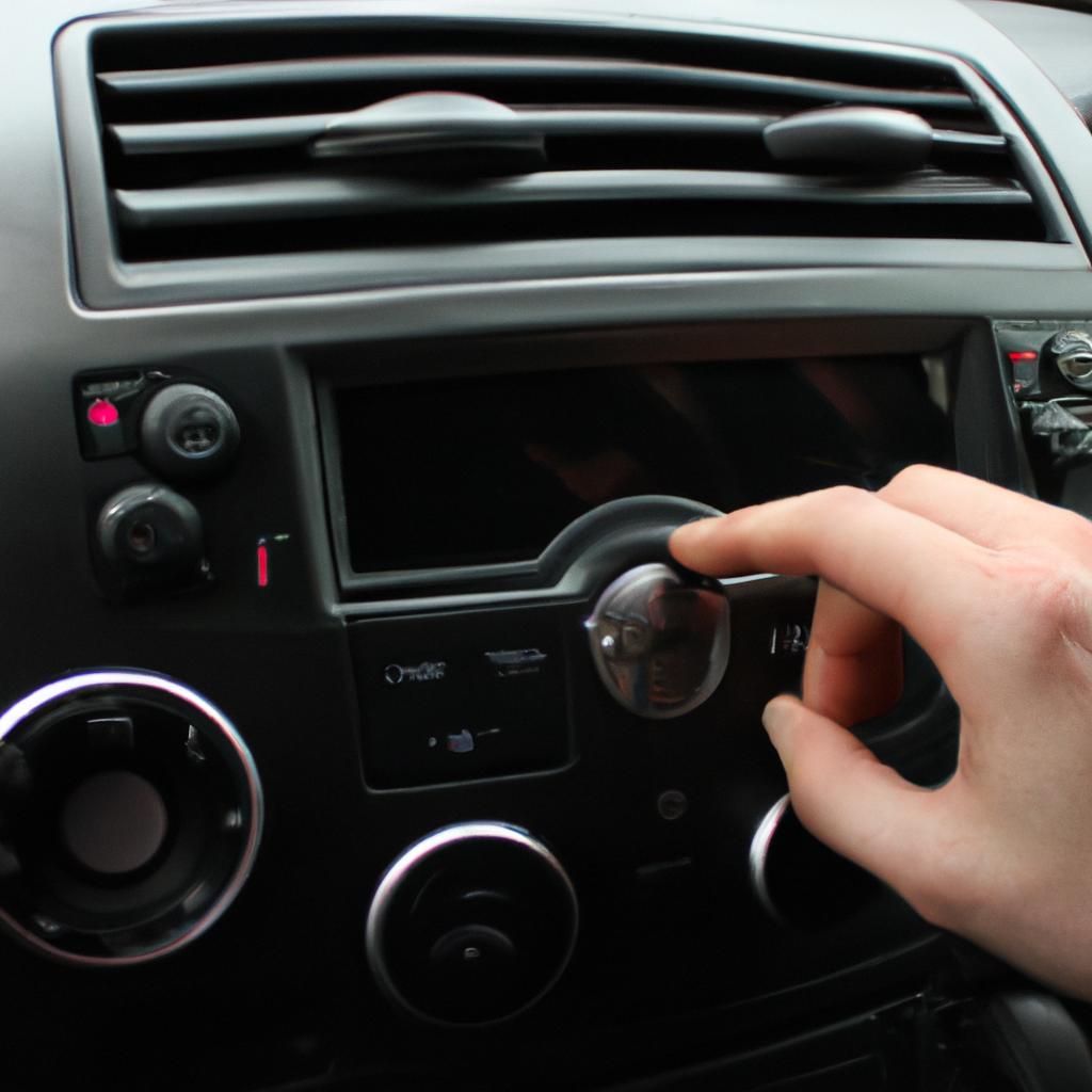 Person adjusting car radio presets