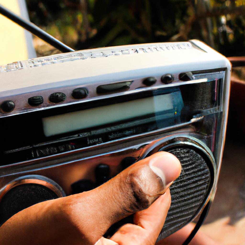 Person holding a radio receiver
