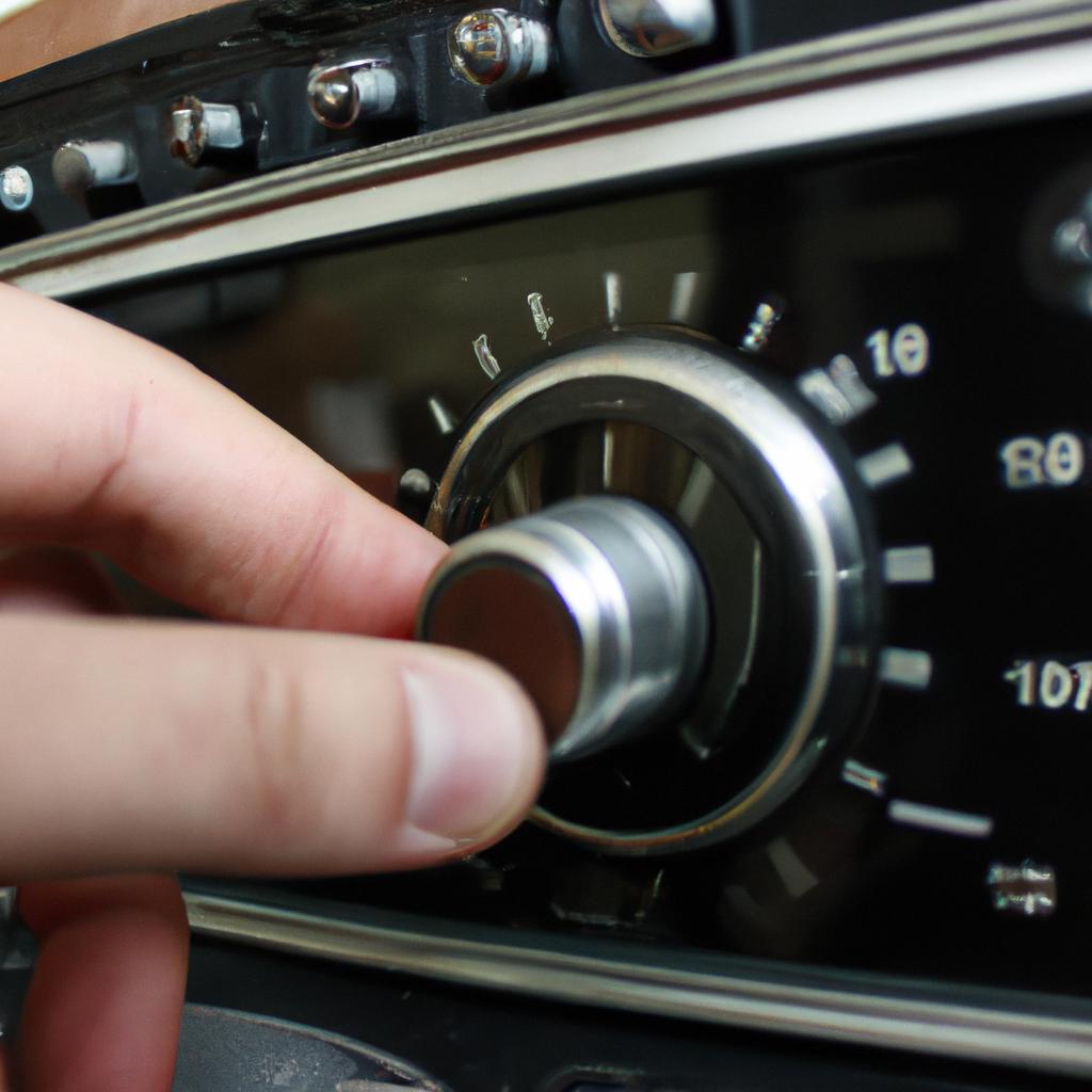 Person adjusting radio dial knob